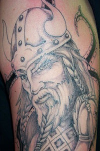 Viking warrior head with beard tattoo