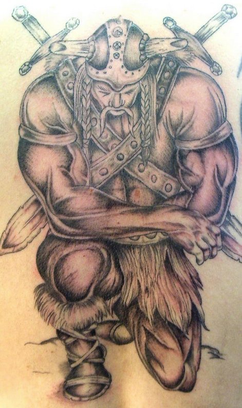 Strong viking warrior kneeling tattoo