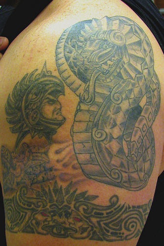 Big hand tattoo with warrior and snake