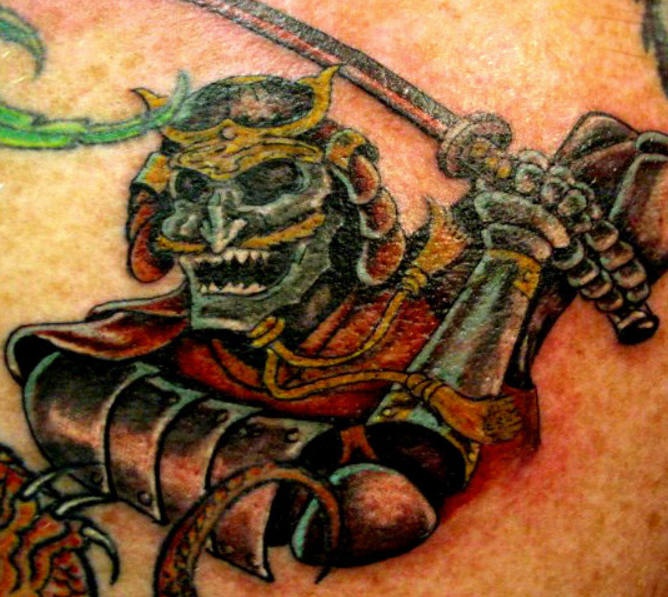 Colored green monster warrior with sword tattoo