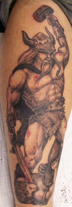 Savage warrior with hammer and sword in blood tattoo