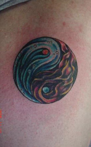 Yin and yang tattoo with water and fire