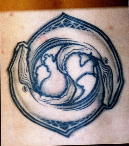 Water animal tattoo with yin yang sign