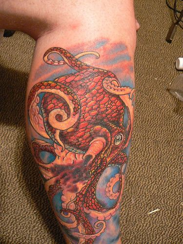 Water animal leg tattoo with colorful octopus
