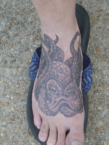 Water animal tattoo with octopus on foot
