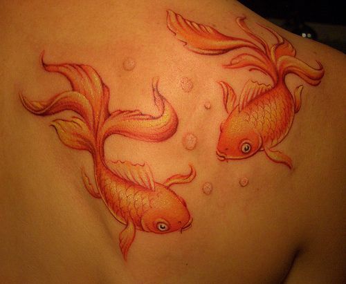 Water animal tattoo with two goldfishes