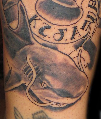 Water animal tattoo with shark and lifebuoy