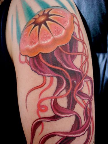 Tattoo with big pink jellyfish on whole hand