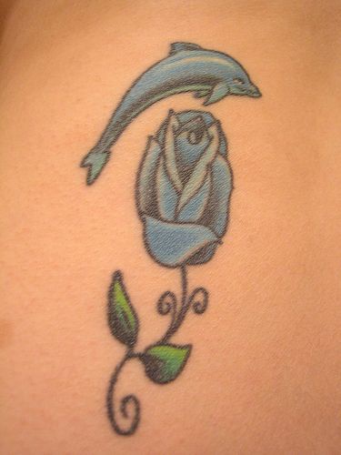 Water animal tattoo with dolphin and rose in blue color