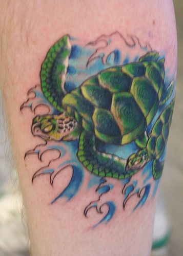 Serious green turtles in the waves tattoo