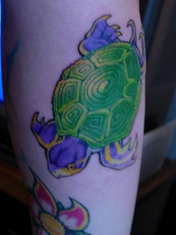 Water animal tattoo with colorful turtle