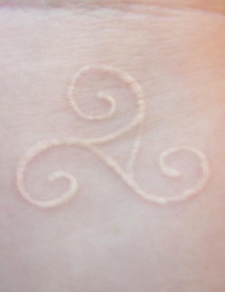 Beautiful white ink tattoo on wrist