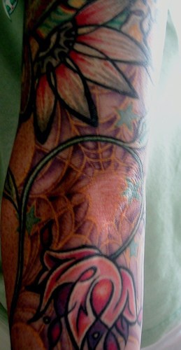 White orchid flowers on web tattoo