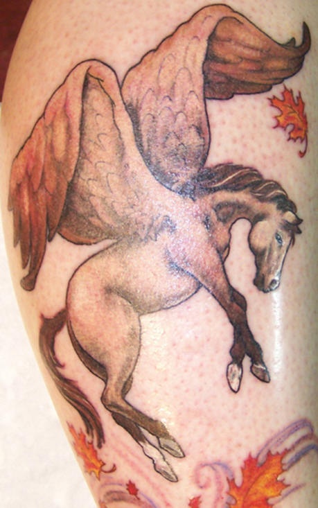 Flying pegasus and fallen leaves tattoo