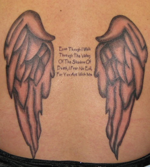 Angel wings and script tattoo