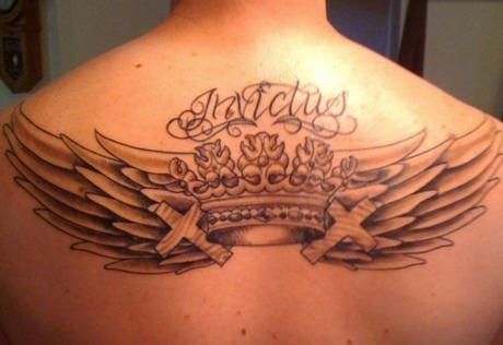 Crown with wings tattoo in crosses on upper back