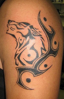 Nice tattoo with tribal wolf