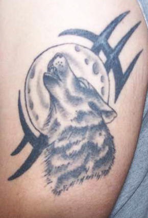 Wolf tattoo with a moon
