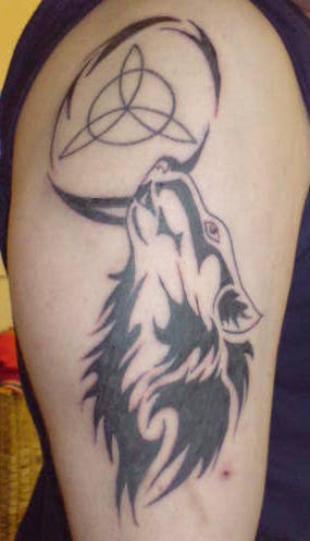 Wolf tattoo with tribal sign