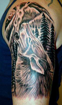 Big tattoo with wolf in the forest