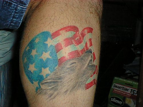 Wolf and american flag tattoo