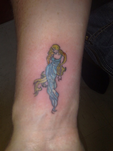 Blonde girl on wrist tattoo