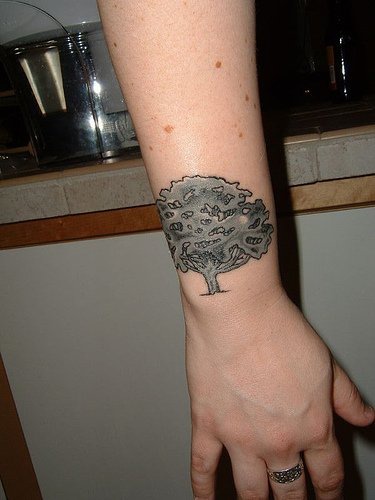 Tree outward wrist tattoo