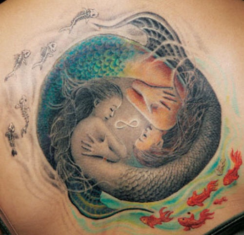 Ying yang style two mermaids tattoo