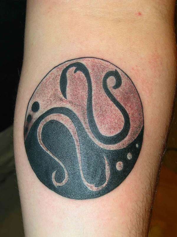 Round yin yang tattoo with monogram