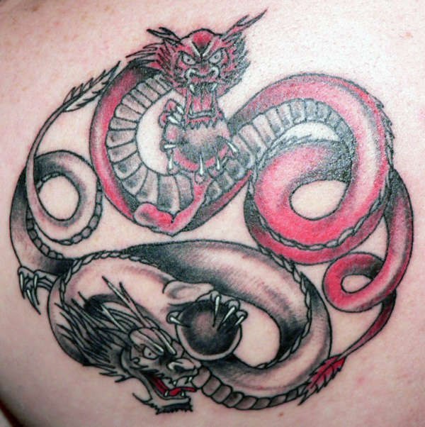 Yin yang tattoo with red & black dragons
