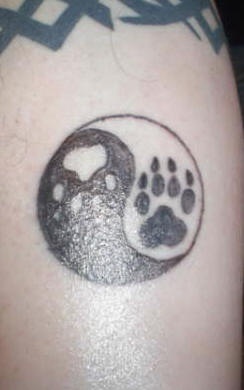 Yin yang tattoo with animal paws