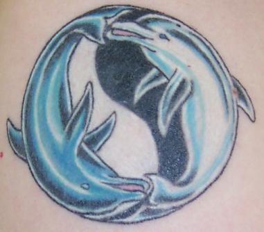 Yin yang tattoo with two dolphins