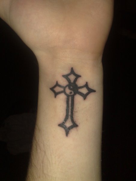 Absurd yin yang cross tattoo on wrist - Tattooimages.biz