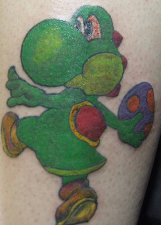 Yoshi from mario coloured tattoo