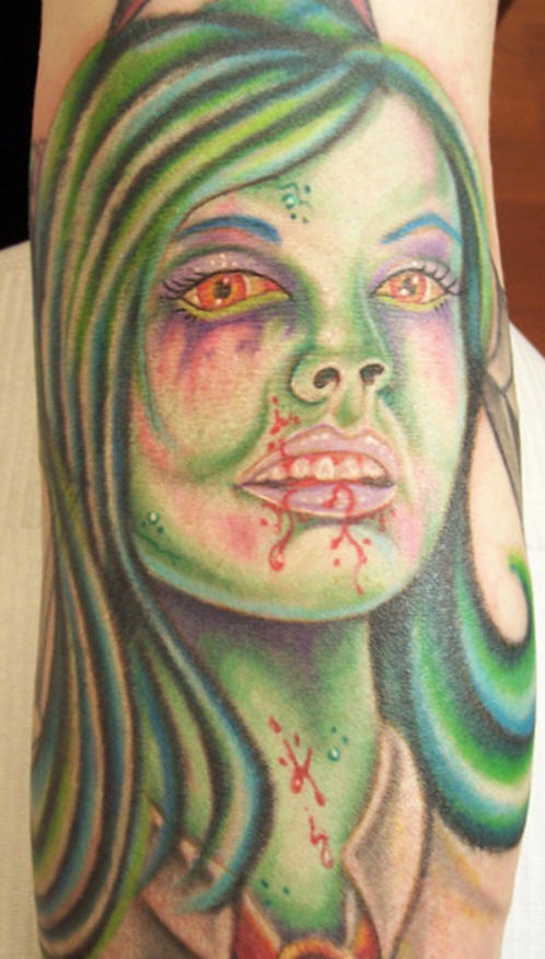 Green zombie girl tattoo