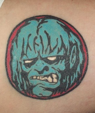 Small zombie face tattoo