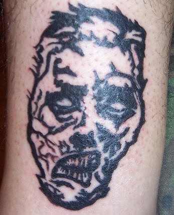 Zombie man face tattoo