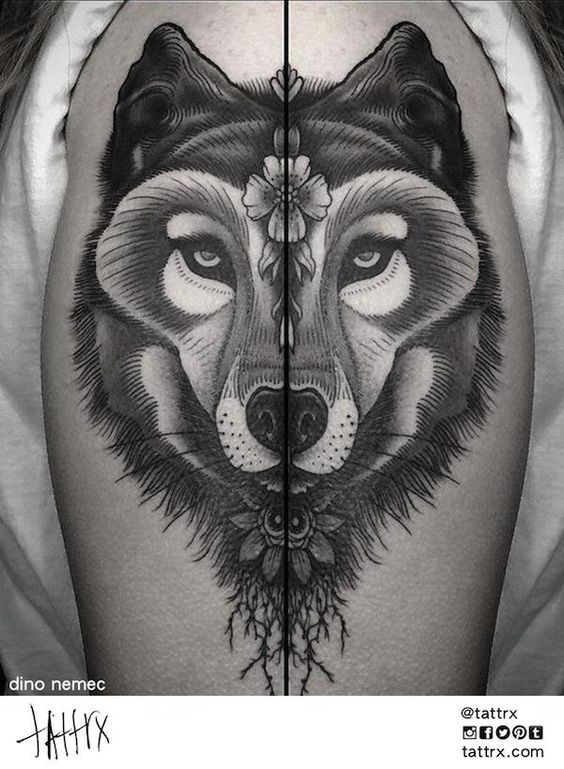 Tattoo painted by Dino Nemec upper arm tattoo of wolf with flowers