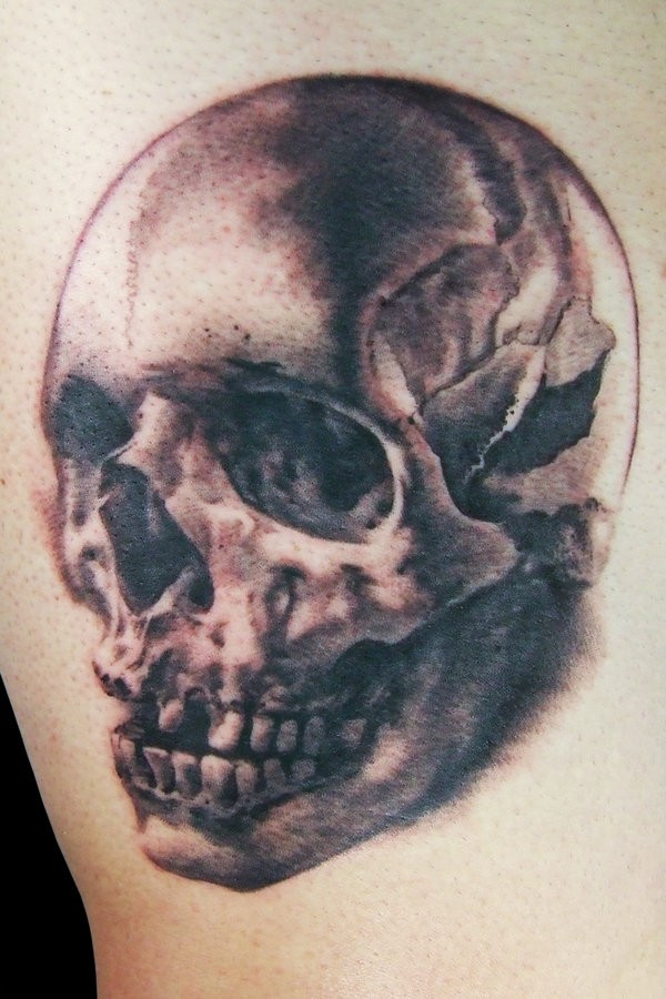 Realistic broken skull tattoo
