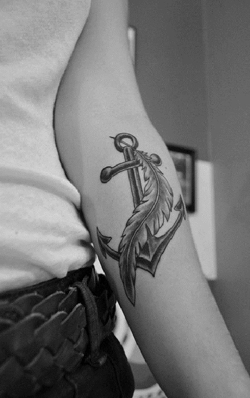 Tattoo with traditional anchor and feather