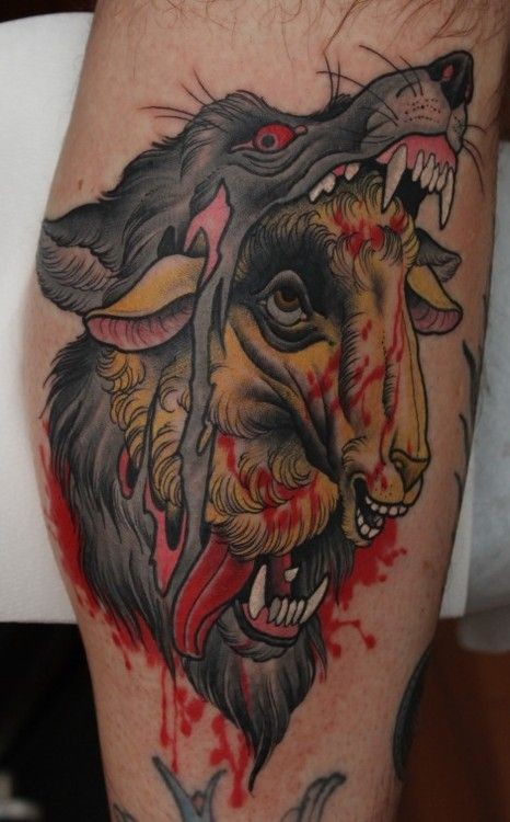 Terrifying colored massive beast eating sheep tattoo on leg muscle