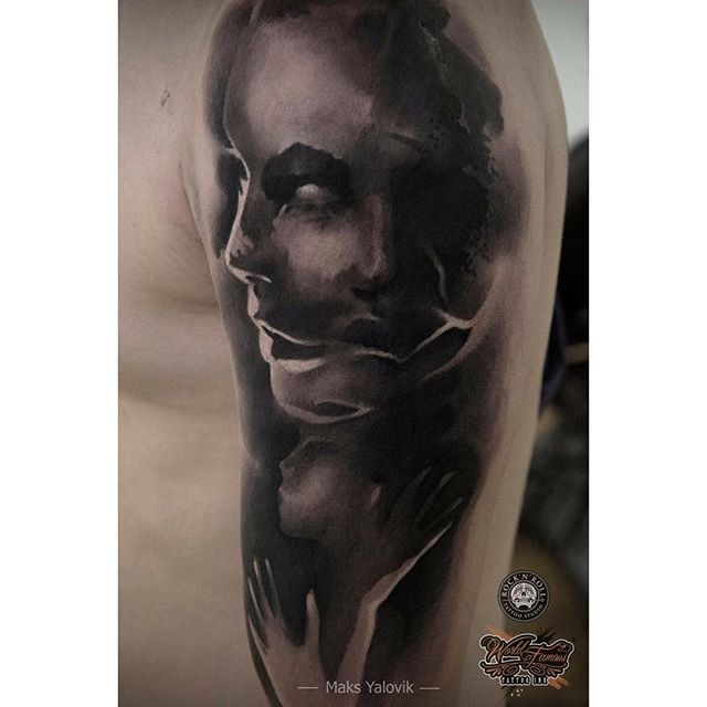 Terrifying looking shoulder tattoo of woman face