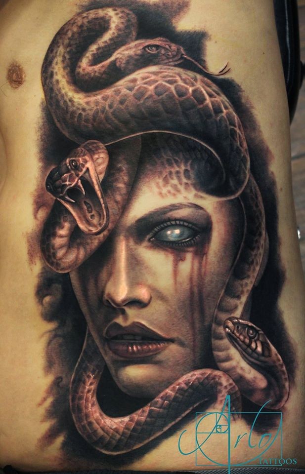 Terrifying mystical Gorgon Medusa with bloody tears colored side tattoo