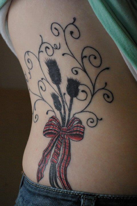 Thistle black scotland tattoo with curls and ribbon