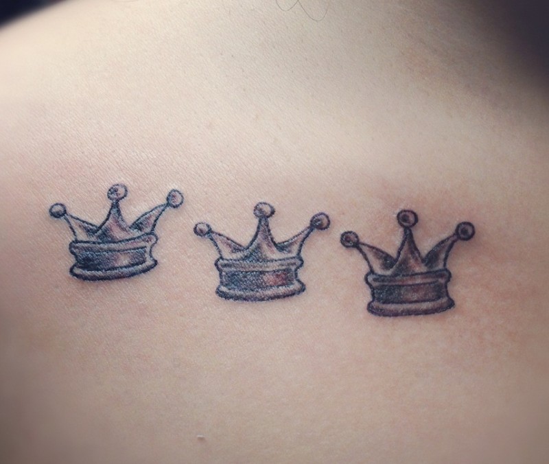 Three little pretty crown tattoo on back