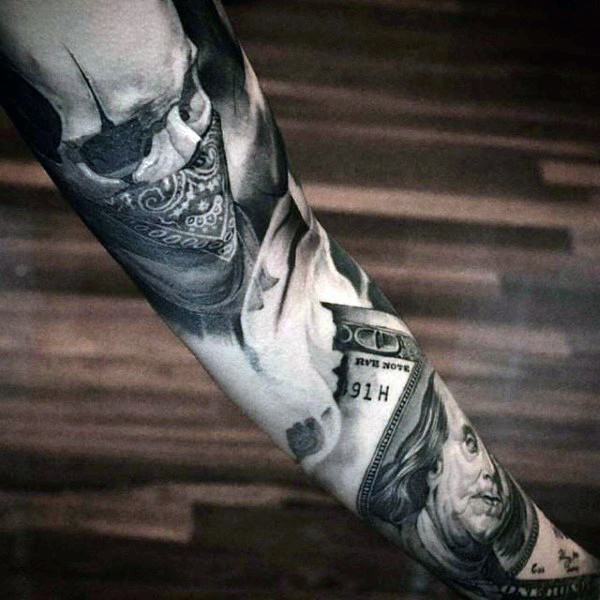 Thug life style colored skull tattoo on sleeve stylized with burning dollar bill