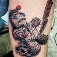 3D amazing looking colorful thug voodoo doll tattoo on arm with knife