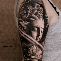3D black and white Buddha statue tattoo on shoulder combined with lotus