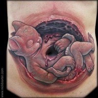 3D creepy looking colored strange embryo tattoo on belly
