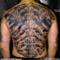 3D like awesome detailed massive bones tattoo on whole back